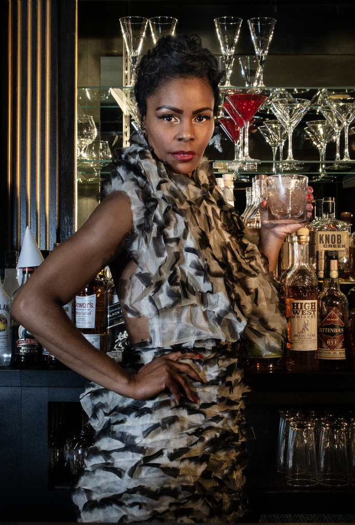 Shanell Verandez at the bar Rittenhouse Grill Philadelphia wearing a KVaughn dress winter collection 2022