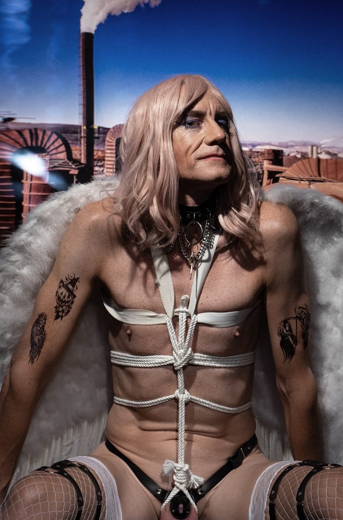 nude male in white bondage rope and Victoria Secrets white wings by photographer Tony Ward